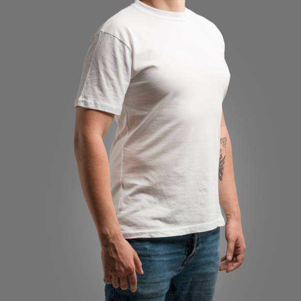 istock Man wearing a white cotton shirt with empty space for your text or logo isolated on gray background 1128659851