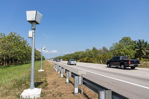 Speed trap surveillance camera along highway to control speeding to reduce speeding related accident