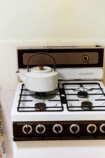Retro style stove top with vintage kettle.