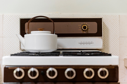 Surface level with stove top & tea kettle.