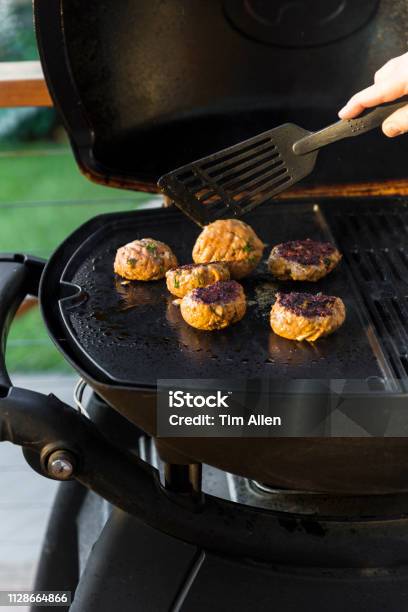 Flipping Homemade Burgers Over To Cook Over Side Stock Photo - Download Image Now - Adult, Australia, Backgrounds