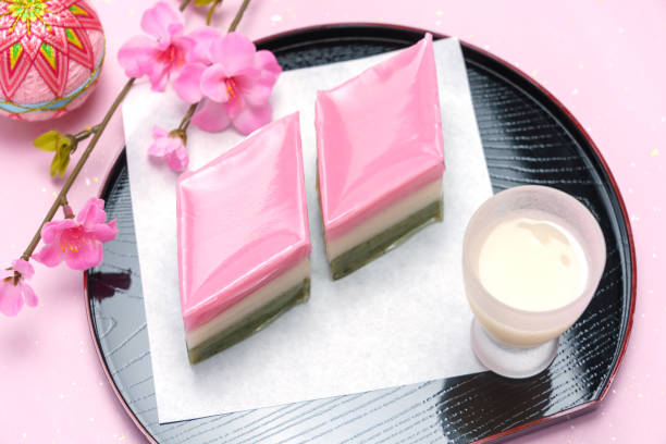 istock red, white, and green lozenge-shaped rice cakes and non-alcoholic rice drink (used for Japanese Girls' Festival) 1128665919