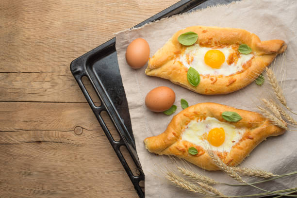 istock Khachapuri is a traditional Georgian cheese and egg-filled bread. With empty space for writing 1128667503