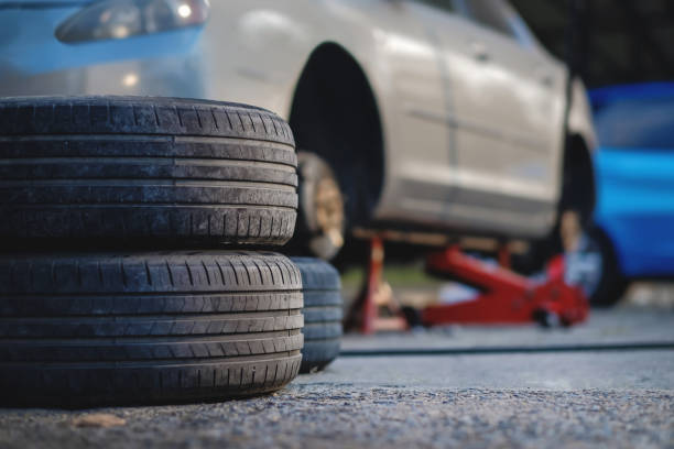 istock Tire Replacement concept. Garage' Tools and Equipment. Car Maintenance and services 1128668715