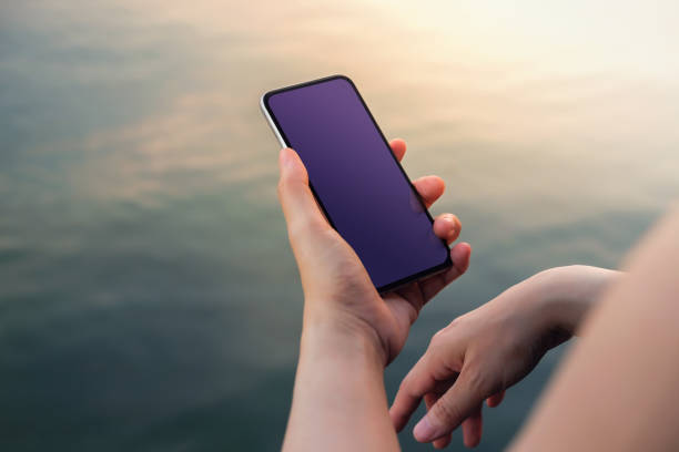 istock Smartphone Mockup Image. Display Screen is Clipping Path. Woman using Mobile Phone 1128668724
