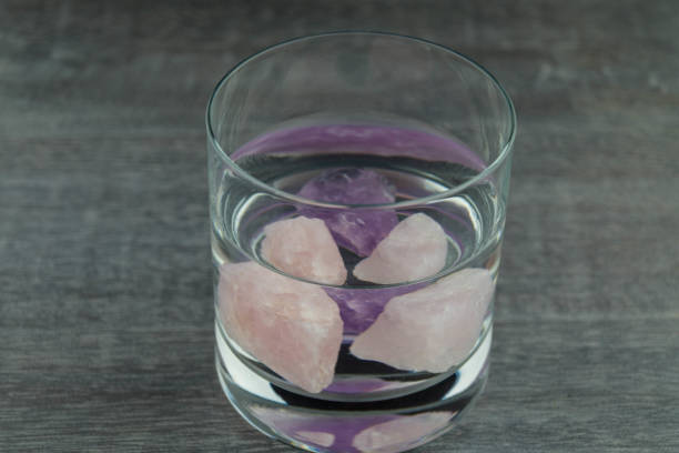 Rose quartz and amethyst Rose quartz and amethyst are energetic crystals for the refinement of drinking water crystalline inclusion complex stock pictures, royalty-free photos & images