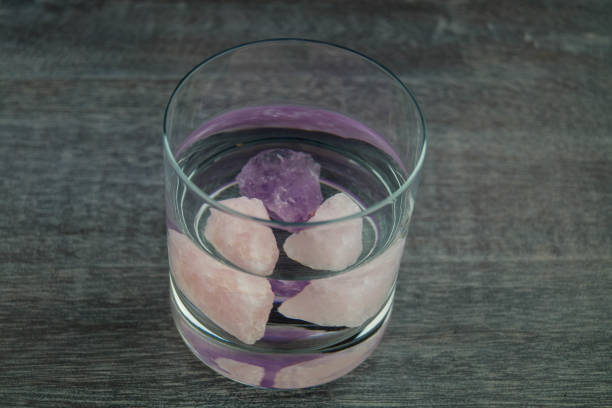 Rose quartz and amethyst Rose quartz and amethyst are energetic crystals for the refinement of drinking water crystalline inclusion complex stock pictures, royalty-free photos & images