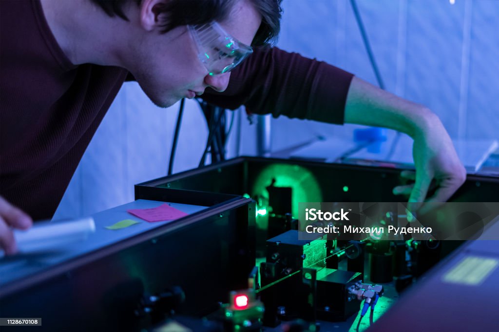 scientist work with laser machine or system b scientist work with laser machine or system Physics Stock Photo