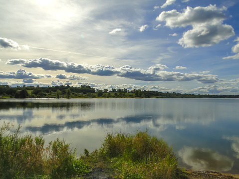 cloudy landscape over the lake at sunset