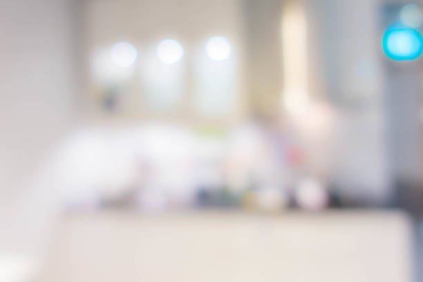 istock Blur background,Modern kitchen counter top with housewares appliances and bokeh light.. 1128673321
