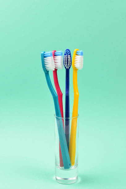 istock Toothbrushes on a green background. Space for text or design. 1128677261