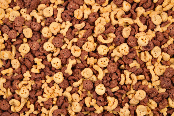 istock Chocolate flakes in the form of skulls and bones background. Top view. 1128678202