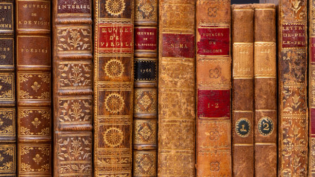 Row of ancient books with leather bindings Row of ancient books with typical 18th century leather bindings. French language poetry literature photos stock pictures, royalty-free photos & images