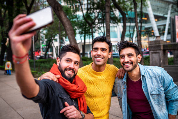Selfie time. Three male friends making a self portrait three amigos stock pictures, royalty-free photos & images