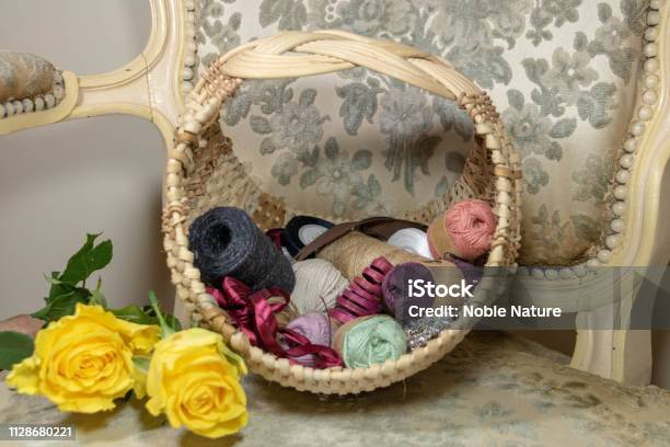 Female Boudoir Josephinashaped Wicker Basket For Needle And Yellow Rose Work On Ancient Shepherdess Stock Photo - Download Image Now