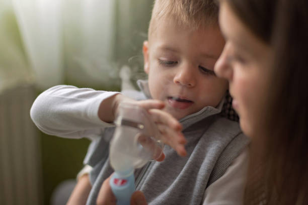 istock Little boy inhaling at home 1128680239
