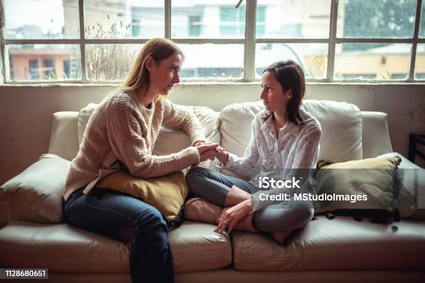 Mother And Daughter Having A Talk Stock Photo - Download Image Now - Parent, Teenager, Discussion