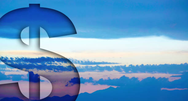 istock US dollar sign in the sky, abstract image. 1128681725