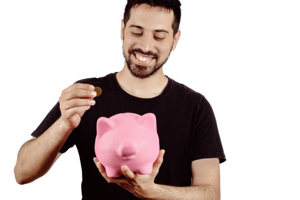 istock Young man with piggy bank 1128682978