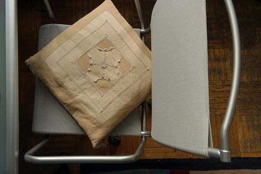 Overhead shot of a modern chair and pillow on the seat