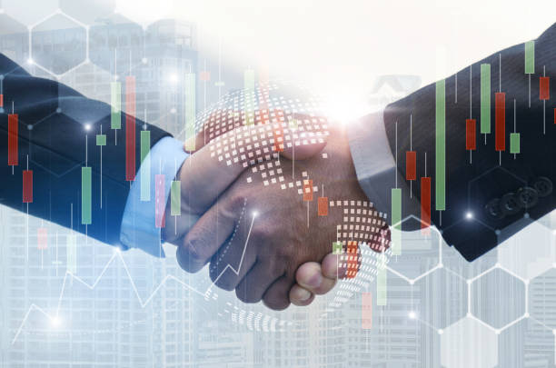 istock business man handshake with effect global world map network link connection and graph chart of stock market graphic diagram, digital technology, internet communication, teamwork, partnership concept 1128684693