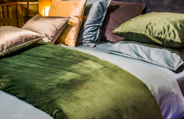 istock bed with sheets and pillows in diverse colors, modern bedroom interiors 1128685881