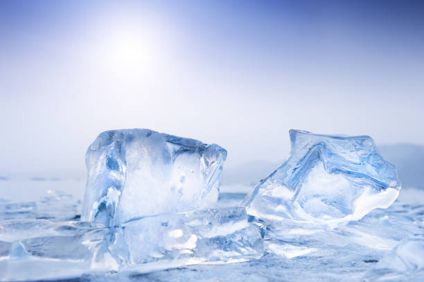 Blue Ice on the frozen lake Blue Ice on the frozen lake at sunset. Shallow depth of field. icicle snowflake winter brilliant stock pictures, royalty-free photos & images