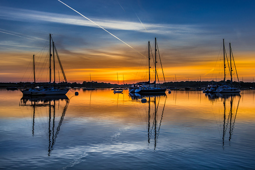 Dawn breaks at Itchenor moorings, Chichecter harbour West Sussex UK