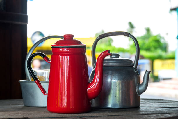 istock Antique Red Kettle and  old aluminium kettle 1128687624