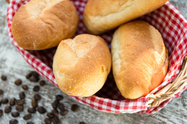 istock French bread baguette on red gingham check cloth in basket 1128687748