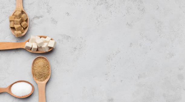 istock Collection of different kinds of sugar on gray background 1128689647