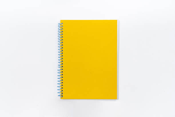 yellow notebook on white background with clipping path - image - spiral notebook imagens e fotografias de stock