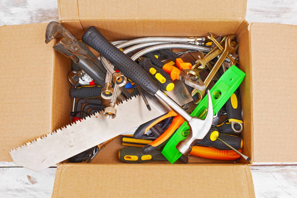 istock top view of various handyman tools in cardboard box 1128690927