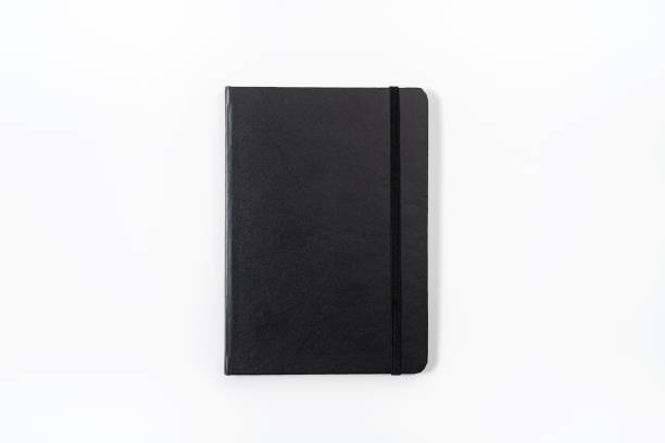 caderno preto sobre fundo branco, com traçado de recorte - leather folder - fotografias e filmes do acervo