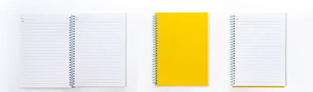 yellow notebook on white background with clipping path - image - spiral notebook imagens e fotografias de stock