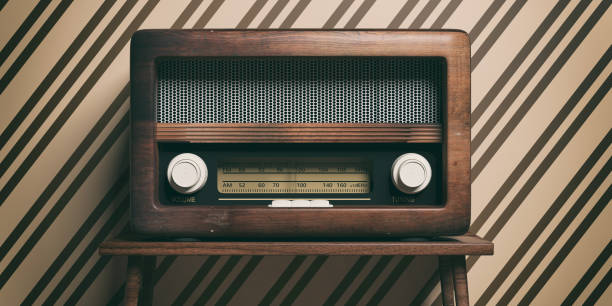istock Radio old fashioned on wooden table, retro wall background, 3d illustration 1128693159