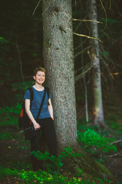 istock Woman hiking in the forest 1128693703