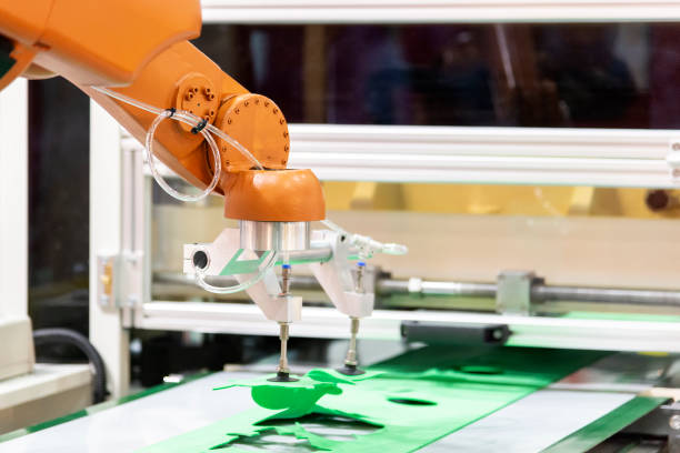 istock The robotic arm in trimming production line. 1128694537