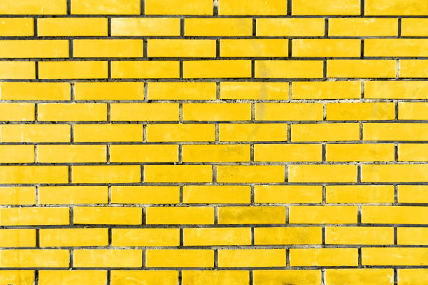 istock Yellow brick wall of decorative brick 1128694548