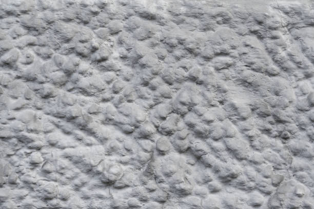 istock Texture of gray stone wall with rough stucco surface 1128695071