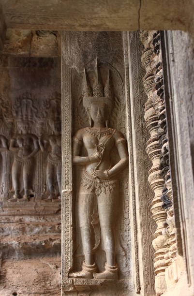 istock Beautiful apsara sculpture at Khmer temple 1128695236