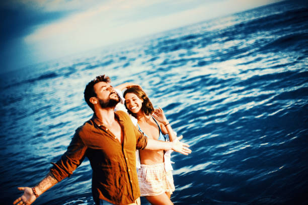 istock Enjoying a walk by the sea. 1128697197