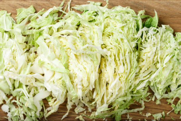 istock finely chopped savoy cabbage on wooden background 1128702739