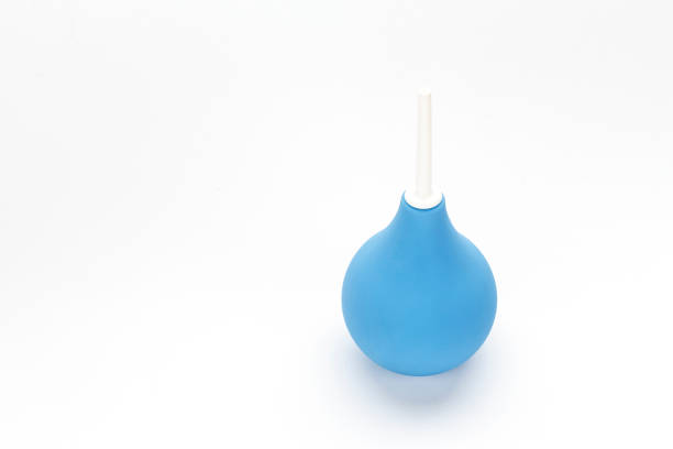 istock blue enema with white plastic cap isolated on white background. 1128703564