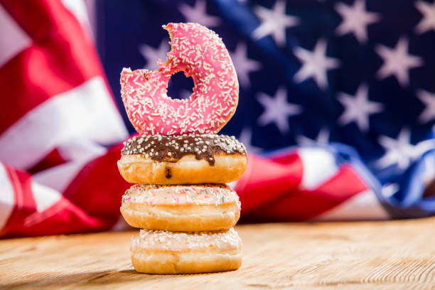 istock Donuts and money  on wooden 1128705020