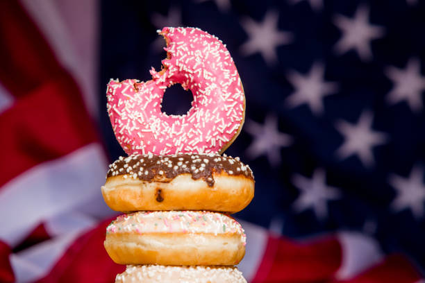 istock Sweet  donuts isolated over waving american flag 1128705033