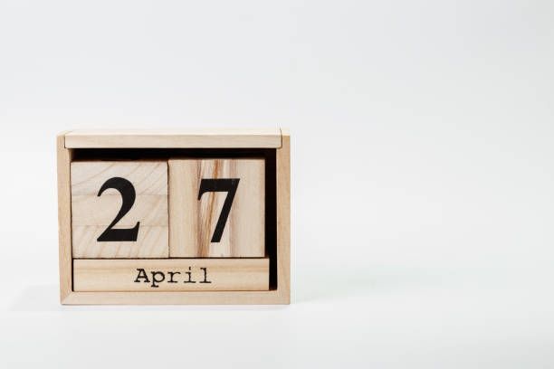 istock Wooden calendar April 27 on a white background 1128705050