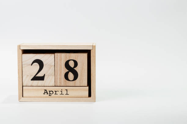 istock Wooden calendar April 28 on a white background 1128705096