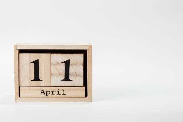 istock Wooden calendar April 11 on a white background 1128705132
