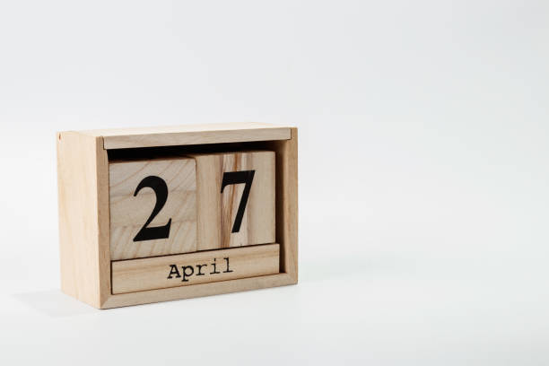 istock Wooden calendar April 27 on a white background 1128705168